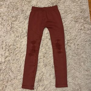Rust colored Nikibiki distressed moto leggings